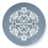 A decorative pattern adorns this versatile salad plate, perfect for a medley of greens or a selection of juicy fruits.