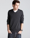 Crafted in soft merino wool, this handsome v neck sweater is accented with tonal sateen panels at the shoulder.