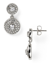 Pave-set crystals frame faceted cubic zirconia stones on these rhodium-plated earrings from Nadri. Wear this pair to take evening looks from simple to stunning. Pave-set crystals frame faceted cubic zirconia stones on these rhodium-plated earrings from Nadri. Wear this pair to take evening looks from simple to stunning.