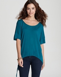 A side tie lends interest to this richly hued ALTERNATIVE top--the perfect companion to your favorite jeans. A side tie lends interest to this richly hued ALTERNATIVE top--the perfect companion to your favorite jeans.