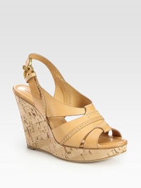 Natural cork wedge with rich leather straps and an adjustable slingback. Cork wedge, 4 (100mm)Cork platform, 1 (25mm)Compares to a 3 heel (75mm)Leather upperLeather lining and solePadded insoleMade in ItalyOUR FIT MODEL RECOMMENDS ordering one half size up as this style runs small. Natural cork wedge with rich leather straps and an adjustable slingback. Cork wedge, 4 (100mm)Cork platform, 1 (25mm)Compares to a 3 heel (75mm)Leather upperLeather lining and solePadded insoleMade in ItalyOUR FIT MODEL RECOMMENDS ordering one half size up as this style runs small.