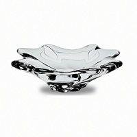 Sensuous undulations play with the light in this curvy crystal bowl. Sensuous undulations play with the light in this curvy crystal bowl.
