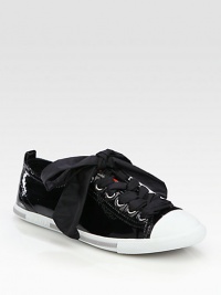 Lace-up patent leather sneaker with a contrasting toecap and sole. Rubber-covered platform, ½ (15mm)Patent leather and leather upperLeather liningRubber solePadded insoleImportedOUR FIT MODEL RECOMMENDS ordering one half size up as this style runs small. Lace-up patent leather sneaker with a contrasting toecap and sole. Rubber-covered platform, ½ (15mm)Patent leather and leather upperLeather liningRubber solePadded insoleImportedOUR FIT MODEL RECOMMENDS ordering one half size up as this style runs small.