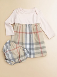 A t-shirt soft top is joined by a woven checked skirt in this adorable design that dresses up your little one in cotton comfort.Round ribbed necklineEnvelope shoulders for pullover easeLong sleevesGathered Empire waistFull woven skirtMatching bloomers with elasticized waist and leg openingsCottonMachine washImported