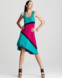 With a nod to the '80s, this Karen Kane dress makes the most of sporty chic. Cheery turquoise sets the scene for a bold burst of fuchsia, while striking black stripes pull the elements together. With a nod to the '80s, this Karen Kane dress makes the most of sporty chic. Cheery turquoise sets the scene for a bold burst of fuchsia, while striking black stripes pull the elements together.