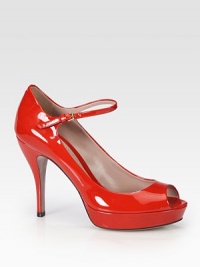 Patent leather high-heel platform silhouette with an adjustable Mary Jane-style strap. Self-covered heel, 4 (100mm)Covered platform, 1 (25mm)Compares to a 3 heel (75mm)Patent leather upperPeep toeAdjustable ankle strapLeather lining and solePadded insoleMade in Italy Patent leather high-heel platform silhouette with an adjustable Mary Jane-style strap. Self-covered heel, 4 (100mm)Covered platform, 1 (25mm)Compares to a 3 heel (75mm)Patent leather upperPeep toeAdjustable ankle strapLeather lining and solePadded insoleMade in Italy