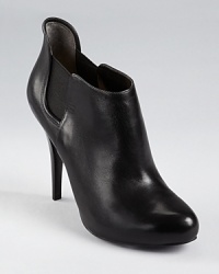 An elevated update to the chelsea boot, these leather GUESS booties are as classic as they are cool. An elevated update to the chelsea boot, these leather GUESS booties are as classic as they are cool.