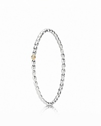 A dazzling diamond set in a 14K gold bezel catches the eye on PANDORA's beaded sterling silver bangle. A dazzling diamond set in a 14K gold bezel catches the eye on PANDORA's beaded sterling silver bangle.
