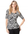 A black-and-white print updates the silhouette of the season, the peplum. INC's top puts a bold, graphic twist on the trend.