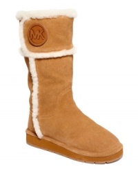 Stay warm and in style with MICHAEL Michael Kors' Winter shearling tall cold weather boots. They feature the designer's logo on the upper shaft and cozy shearling lining. Stay warm and in style with MICHAEL Michael Kors' Winter shearling tall cold weather boots. They feature the designer's logo on the upper shaft and cozy shearling lining.
