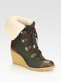 A rubber wedge lifts this nylon ankle boot topped with suede laces, leather trim and plush shearling. Rubber wedge, 3 (75mm)Nylon and shearling upper with suede laces and leather trimLeather liningRubber solePadded insoleImportedThis style runs true to size. We recommend ordering your usual size for a standard fit. A rubber wedge lifts this nylon ankle boot topped with suede laces, leather trim and plush shearling. Rubber wedge, 3 (75mm)Nylon and shearling upper with suede laces and leather trimLeather liningRubber solePadded insoleImportedThis style runs true to size. We recommend ordering your usual size for a standard fit.