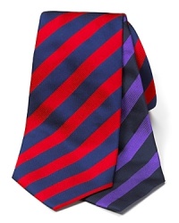 Bold stripes lend a sleek suit a fashionable pop of color. Bold stripes lend a sleek suit a fashionable pop of color.