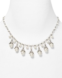 Shimmering glass pearls and crystal accents are an elegant focal point on this Lauren Ralph Lauren necklace, accented by a simple silver tone chain. Shimmering glass pearls and crystal accents are an elegant focal point on this Lauren Ralph Lauren necklace, accented by a simple silver tone chain.