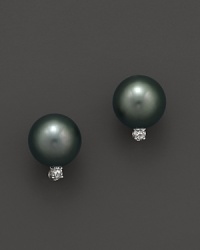 A timeless classic, these Tara Pearls earrings pair a black Tahitian pearl with a sparkling diamond accent. A timeless classic, these Tara Pearls earrings pair a black Tahitian pearl with a sparkling diamond accent.