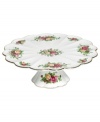 Garnished with the popular Old Country Roses dinnerware pattern, this Royal Albert cake stand brings the bounty of the English countryside to your table in fine bone china with gold, scalloped edges.