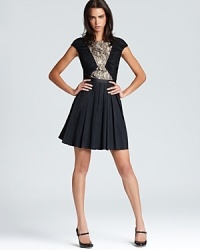 A pleated skirt lends a youthful look to Aqua's lace-detailed dress--complete the look with patent maryjane pumps. A pleated skirt lends a youthful look to Aqua's lace-detailed dress--complete the look with patent maryjane pumps.