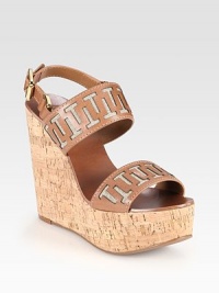 Grounded by a cork wedge and platform, soft linen peeks out from underneath wide leather straps forming signature T designs. Cork wedge, 5 (125mm)Covered platform, 1½ (40mm)Compares to a 3½ heel (90mm)Leather and linen upperLeather liningRubber soleImportedOUR FIT MODEL RECOMMENDS ordering one half size up as this style runs small. Grounded by a cork wedge and platform, soft linen peeks out from underneath wide leather straps forming signature T designs. Cork wedge, 5 (125mm)Covered platform, 1½ (40mm)Compares to a 3½ heel (90mm)Leather and linen upperLeather liningRubber soleImportedOUR FIT MODEL RECOMMENDS ordering one half size up as this style runs small.