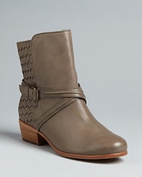 Joie delivers a low-key, highly wearable interpretation of the Western bootie trend in this design, with subtle tonal woven leather and wrap buckle accents. Joie delivers a low-key, highly wearable interpretation of the Western bootie trend in this design, with subtle tonal woven leather and wrap buckle accents.