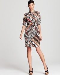 Bustling with a lively mix of animal prints, this Calvin Klein shirt dress sends your 9-to-5 style on a wild safari ride. Polish off the look with sleek black wedges for a roaring fashion statement. Bustling with a lively mix of animal prints, this Calvin Klein shirt dress sends your 9-to-5 style on a wild safari ride. Polish off the look with sleek black wedges for a roaring fashion statement.