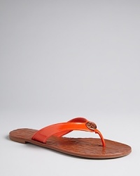 Flip for these fab Tory Burch Flats, with logo-stamped soles and pops of patent, accented with subtly stylish signature logo hardware. Flip for these fab Tory Burch Flats, with logo-stamped soles and pops of patent, accented with subtly stylish signature logo hardware.