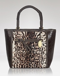 Elegant allure in carryall proportions. This Elie Tahari tote gets it day-right in calf hair, trimmed in leather with perfectly polished details. Elegant allure in carryall proportions. This Elie Tahari tote gets it day-right in calf hair, trimmed in leather with perfectly polished details.