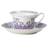 Inspired by the opulent parties of Louis XIV's Royal Court, Versace's Le Grand Divertissement collection is as ornate and luxurious as you'd expect from the Italian design house. The iconic Arabesque leaf design is rendered in lavender and gold against a classic white background with no attention to detail spared. Inspired by the opulent parties of Louis XIV's Royal Court, Versace's Le Grand Divertissement collection is as ornate and luxurious as you'd expect from the Italian design house. The iconic Arabesque leaf design is rendered in lavender and gold against a classic white background with no attention to detail spared.