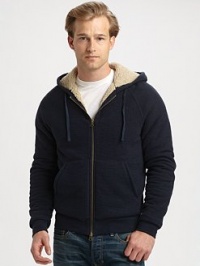 The ultimate in winter warmth and style marries the easy comfort of a cozy, lined cotton knit hoodie.Two-way zip frontAttached drawstring hoodKangaroo pocketsLining: polyesterCottonMachine washImportedAdditional Information Men's Shirts & Sweaters Size Guide 