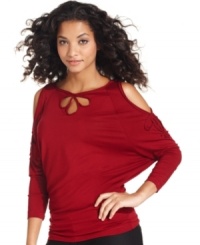 Fashion-forward with all the comforts of soft jersey fabric--Studio M's top features cutout details at the shoulders and neck and a striking dolman sleeve. Fashion-forward with all the comforts of soft jersey fabric--Studio M's top features cutout details at the shoulders and neck and a striking dolman sleeve.