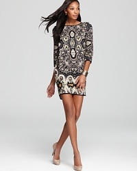 An artistically designed, mosaic-inspired print brings exotic flourish to this Sam & Lavi dress--accentuated by shoulder pads for retro-inspired 80s flair. An artistically designed, mosaic-inspired print brings exotic flourish to this Sam & Lavi dress--accentuated by shoulder pads for retro-inspired 80s flair.