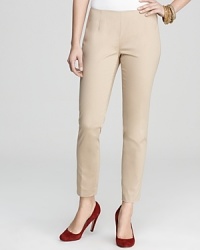 Smartly styled for a clean silhouette, these VINCE CAMUTO slim khakis underscore everything from sharp blazers to barely-there tanks. Smartly styled for a clean silhouette, these VINCE CAMUTO slim khakis underscore everything from sharp blazers to barely-there tanks.