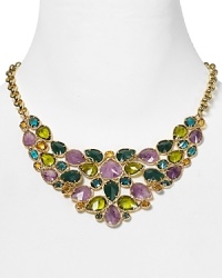 A statement making necklace crafted of luminous 12-karat gold plate, faceted gemstones in a dramatic color palette define this Carolee showpiece. A statement making necklace crafted of luminous 12-karat gold plate, faceted gemstones in a dramatic color palette define this Carolee showpiece.