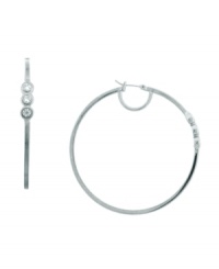 Subtle sparkle that catches the eye. These hoop earrings from Vince Camuto are embellished with shimmering crystal stones. Crafted in rhodium-plated mixed metal. Approximate diameter: 2-1/2 inch. Subtle sparkle that catches the eye. These hoop earrings from Vince Camuto are embellished with shimmering crystal stones. Crafted in rhodium-plated mixed metal. Approximate diameter: 2-1/2 inch.
