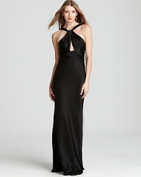 A crisscross neckline lends sophisticated allure, but the deep, scooped back of this ABS by Allen Schwartz gown is what steals the spotlight. A crisscross neckline lends sophisticated allure, but the deep, scooped back of this ABS by Allen Schwartz gown is what steals the spotlight.