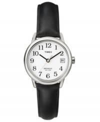Complete your look with simple style. This Timex watch features a black smooth leather strap and silvertone mixed metal round case. White dial with black numerals, logo and date window. Analog movement. Water resistant to 30 meters. One-year limited warranty. Complete your look with simple style. This Timex watch features a black smooth leather strap and silvertone mixed metal round case. White dial with black numerals, logo and date window. Analog movement. Water resistant to 30 meters. One-year limited warranty.