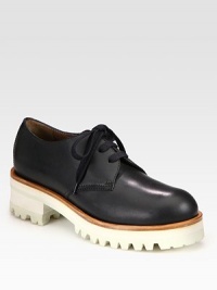 An elevated two-tone platform adds modern appeal to this menswear-inspired design of rich Italian leather. Rubber and foam heel, 1¾ (45mm)Rubber platform, 1 (25mm)Compares to a ¾ heel (20mm)Leather upperLeather liningRubber trek solePadded insoleMade in ItalyOUR FIT MODEL RECOMMENDS ordering one half size up as this style runs small. 