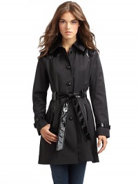 THE LOOKFold-over collarFront button closureLong sleeves with faux leather buckle tabs Faux leather shoulder panels Princess seamsFaux leather tie belt Side seam pockets with faux leather trim Back faux leather yokeBack gusset pleat THE FITAbout 33 from shoulder to hemTHE MATERIALCotton/polyesterTrim: polyester/polyurethaneFully linedCARE & ORIGINDry cleanImportedModel shown is 5'11 (180cm) wearing US size Small. THE LOOKFold-over collarFront button closureLong sleeves with faux leather buckle tabs Faux leather shoulder panels Princess seamsFaux leather tie belt Side seam pockets with faux leather trim Back faux leather yokeBack gusset pleat THE FITAbout 33 from shoulder to hemTHE MATERIALCotton/polyesterTrim: polyester/polyurethaneFully linedCARE & ORIGINDry cleanImportedModel shown is 5'11 (180cm) wearing US size Small.