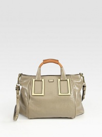 A handsome top-handle lambskin design with goldtone hardware detail and a logo embellishment. Double top handles, 3½ drop Detachable shoulder strap, 15 drop Top-zip closure One inside zip pocket Cotton lining 12W X 9½H X 7D Imported A handsome top-handle lambskin design with goldtone hardware detail and a logo embellishment. Double top handles, 3½ drop Detachable shoulder strap, 15 drop Top-zip closure One inside zip pocket Cotton lining 12W X 9½H X 7D Imported