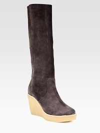 Supremely soft suede knee-high boot has an ultra-high wedge and slight platform. Rubber wedge, 4 (100mm)Rubber platform, 1 (25mm)Compares to a 3 heel (75mm)Shaft, 15Leg circumference, 14Suede upperPull-on styleLeather liningRubber solePadded insoleMade in ItalyOUR FIT MODEL RECOMMENDS ordering one half size up as this style runs small. Supremely soft suede knee-high boot has an ultra-high wedge and slight platform. Rubber wedge, 4 (100mm)Rubber platform, 1 (25mm)Compares to a 3 heel (75mm)Shaft, 15Leg circumference, 14Suede upperPull-on styleLeather liningRubber solePadded insoleMade in ItalyOUR FIT MODEL RECOMMENDS ordering one half size up as this style runs small.