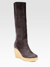 Supremely soft suede knee-high boot has an ultra-high wedge and slight platform. Rubber wedge, 4 (100mm)Rubber platform, 1 (25mm)Compares to a 3 heel (75mm)Shaft, 15Leg circumference, 14Suede upperPull-on styleLeather liningRubber solePadded insoleMade in ItalyOUR FIT MODEL RECOMMENDS ordering one half size up as this style runs small. 