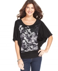 Grace Elements' latest top features feminine touches, like drapey dolman sleeves and a floral-print panel at the front. (Clearance) Grace Elements' latest top features feminine touches, like drapey dolman sleeves and a floral-print panel at the front. (Clearance)
