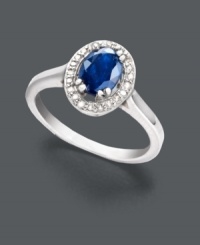 Petite elegance. This sophisticated beauty features a faceted oval-cut sapphire (1 ct. t.w.) with a sparkling halo of round-cut diamond accents. Ring crafted in sterling silver. Size 7.