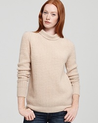 Crafted from luxuriously-soft cashmere with a classic ribbed knit texture, this stylish Theory sweater, updates this timeless turtle with feminine flair. Crafted from luxuriously-soft cashmere with a classic ribbed knit texture, this stylish Theory sweater, updates this timeless turtle with feminine flair.