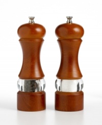 Add depth to any dish and décor with classic salt and pepper mills interpreted for the contemporary kitchen. The tall, beautifully contoured bodies are finished in elegant walnut, offset with a see-through stripe of acrylic that lets you view the mill's contents. Limited lifetime warranty. Add depth to any dish and décor with classic salt and pepper mills interpreted for the contemporary kitchen. The tall, beautifully contoured bodies are finished in elegant walnut, offset with a see-through stripe of acrylic that lets you view the mill's contents. Limited lifetime warranty.