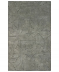 Expanding on classic rug motifs, this modern piece features a clean design of oversized leaves, virtually imprinted on an cool gray background. New Zealand wool is tufted by hand, creating a premium-quality rug with thick, dense pile. Expanding on classic rug motifs, this modern piece features a clean design of oversized leaves, virtually imprinted on an cool gray background. New Zealand wool is tufted by hand, creating a premium-quality rug with thick, dense pile.
