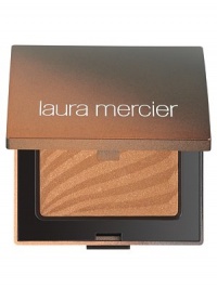 Silky smooth bronzing powder that glides on evenly, giving the skin a soft luminosity and healthy, sunny glow without looking unnatural or heavy. The velvet composition adheres to the skin providing longer wear while special pigments blend evenly into the skin. Oil-free, mistake-proof application provides the perfect 'back to beach' look. 0.28 oz. Silky smooth bronzing powder that glides on evenly, giving the skin a soft luminosity and healthy, sunny glow without looking unnatural or heavy. The velvet composition adheres to the skin providing longer wear while special pigments blend evenly into the skin. Oil-free, mistake-proof application provides the perfect 'back to beach' look. 0.28 oz.
