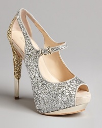 Wow your audience in these show-stopping peep toe platforms. Covered in glitter with metallic heel accents and alluring cutouts, they're evening stars. Wow your audience in these show-stopping peep toe platforms. Covered in glitter with metallic heel accents and alluring cutouts, they're evening stars.