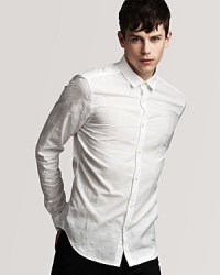 With a small spread collar and allover tonal check print, this sleek shirt bridges the gap between your dress and casual wardrobes. With a small spread collar and allover tonal check print, this sleek shirt bridges the gap between your dress and casual wardrobes.
