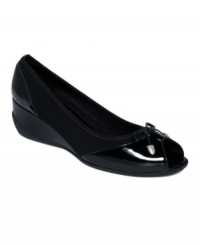 Sleek and chic! Glossy patent leather adds a high-shine finish to Rockport's Trulinda peep-toe pumps. With a decorative bow detail on the vamp, they include a comfortable low rubber wedge heel. Sleek and chic! Glossy patent leather adds a high-shine finish to Rockport's Trulinda peep-toe pumps. With a decorative bow detail on the vamp, they include a comfortable low rubber wedge heel.