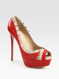 Gleaming leather platform with studded contrast trim and a peep toe. Self-covered heel, 5½ (140mm)Island platform, 1½ (40mm)Compares to a 4 heel (100mm)Studded leather upperLeather lining and solePadded insoleMade in ItalyOUR FIT MODEL RECOMMENDS ordering one half size up as this style runs small. Gleaming leather platform with studded contrast trim and a peep toe. Self-covered heel, 5½ (140mm)Island platform, 1½ (40mm)Compares to a 4 heel (100mm)Studded leather upperLeather lining and solePadded insoleMade in ItalyOUR FIT MODEL RECOMMENDS ordering one half size up as this style runs small.