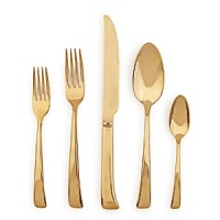 This opulent 5-piece flatware set from Sambonet gets its distinctive polished gold finish through an innovative plating process called physical vapor deposition (PVD). The result is a place setting that is both glamorous and scratch resistant. This opulent 5-piece flatware set from Sambonet gets its distinctive polished gold finish through an innovative plating process called physical vapor deposition (PVD). The result is a place setting that is both glamorous and scratch resistant.